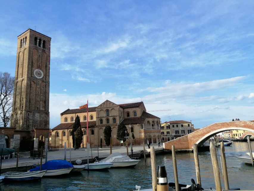 Murano: Glass Lampwork Workshop and Walking Tour - Inside a glass factory showroom in a 1295-era place